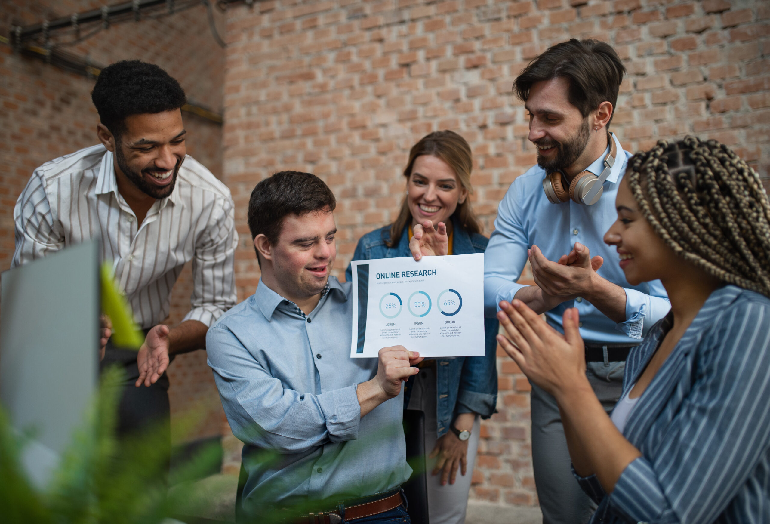 happy-down-syndrome-man-with-business-colleagues